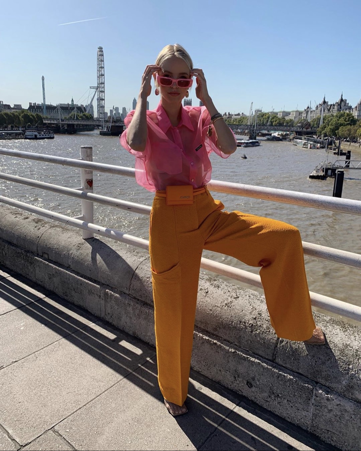 Pink Miu Miu Shirt and Orange Jacquemus Pants in London