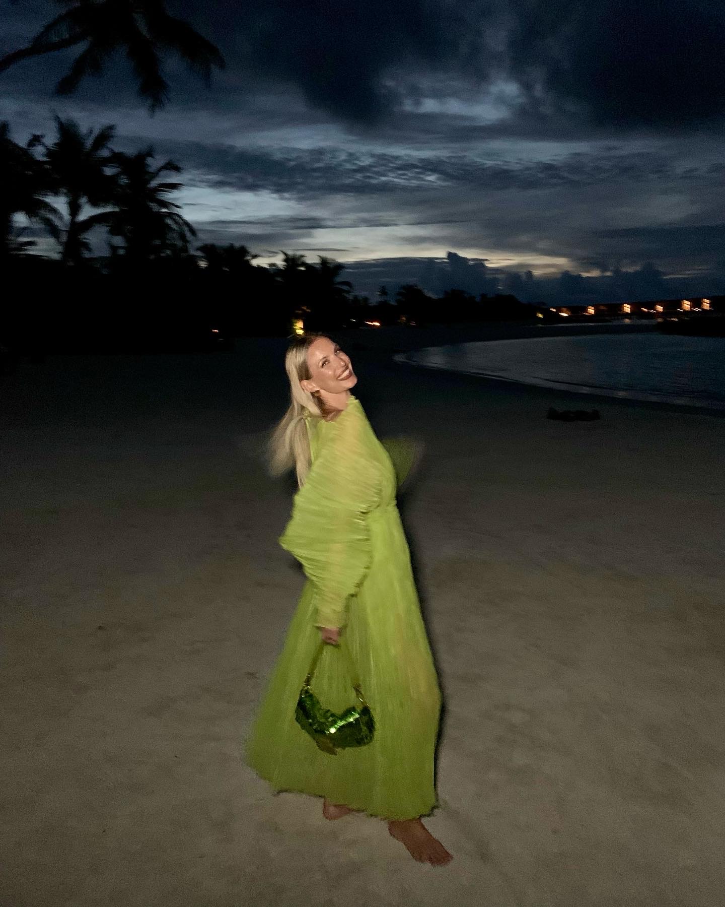 Green dress with Fendi bag